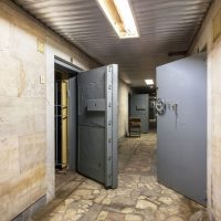 Corridor With Open Armored Doors In An Abandoned F 84HZAN5 Min Scaled